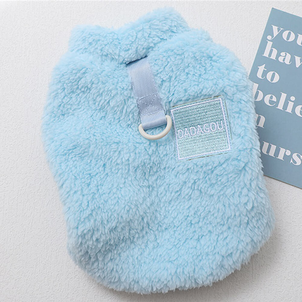 Happy dog playing in a blue Cozy Pet Winter Vest, comfortable pet wear for dogs