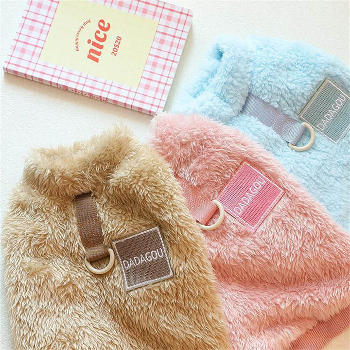 Cute puppy wearing a red Cozy Pet Winter Vest, comfortable dog clothing