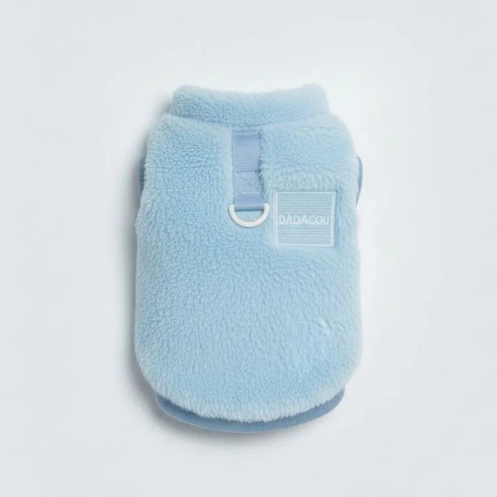 Dog walking outdoors in a blue Cozy Pet Winter Vest, winter dog clothes, pet cozy