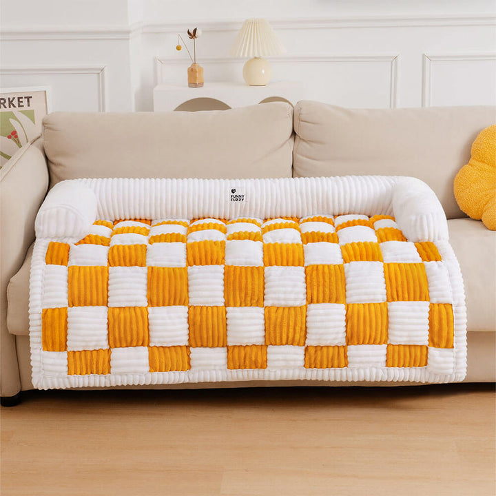 Elegant plaid couch cover, blending into home decor while providing pet comfort.