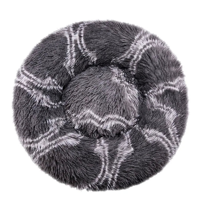 Warm pet bed, round plush donut style with raised edges, offering a sense of security for animals.