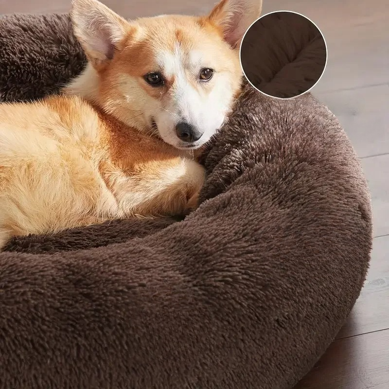 Unisex cat bed, plush and deep for comfort, a washable round donut design for cozy rest.