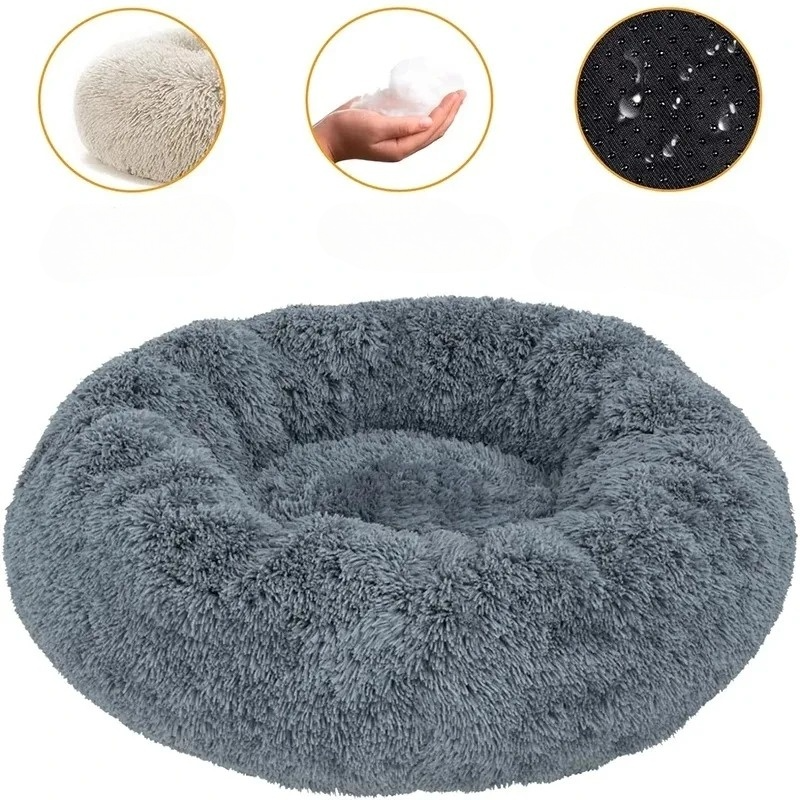 Soft pet bed, round donut style with supportive edges, ideal for dogs and cats to snuggle.