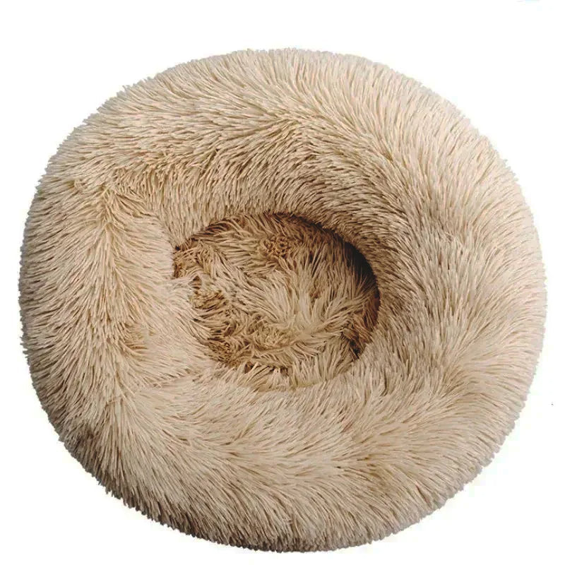 Supportive pet bed, plush round donut design for pets seeking a secure and warm spot.