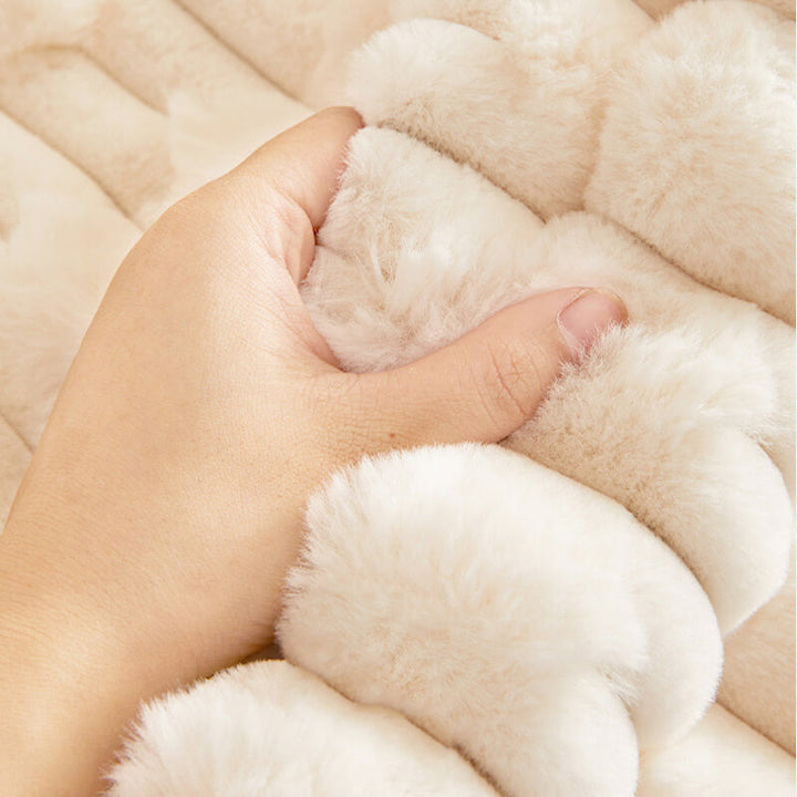 Close-up of the cozy plush fabric and striped pattern of a premium sofa cover, showcasing quality