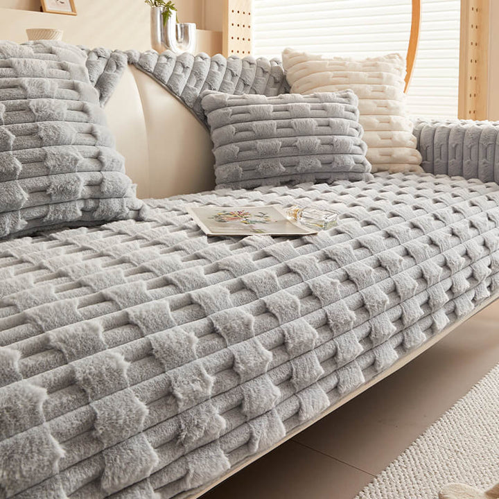 Contemporary striped couch cover in plush material, providing both style and long-lasting protection for sofas