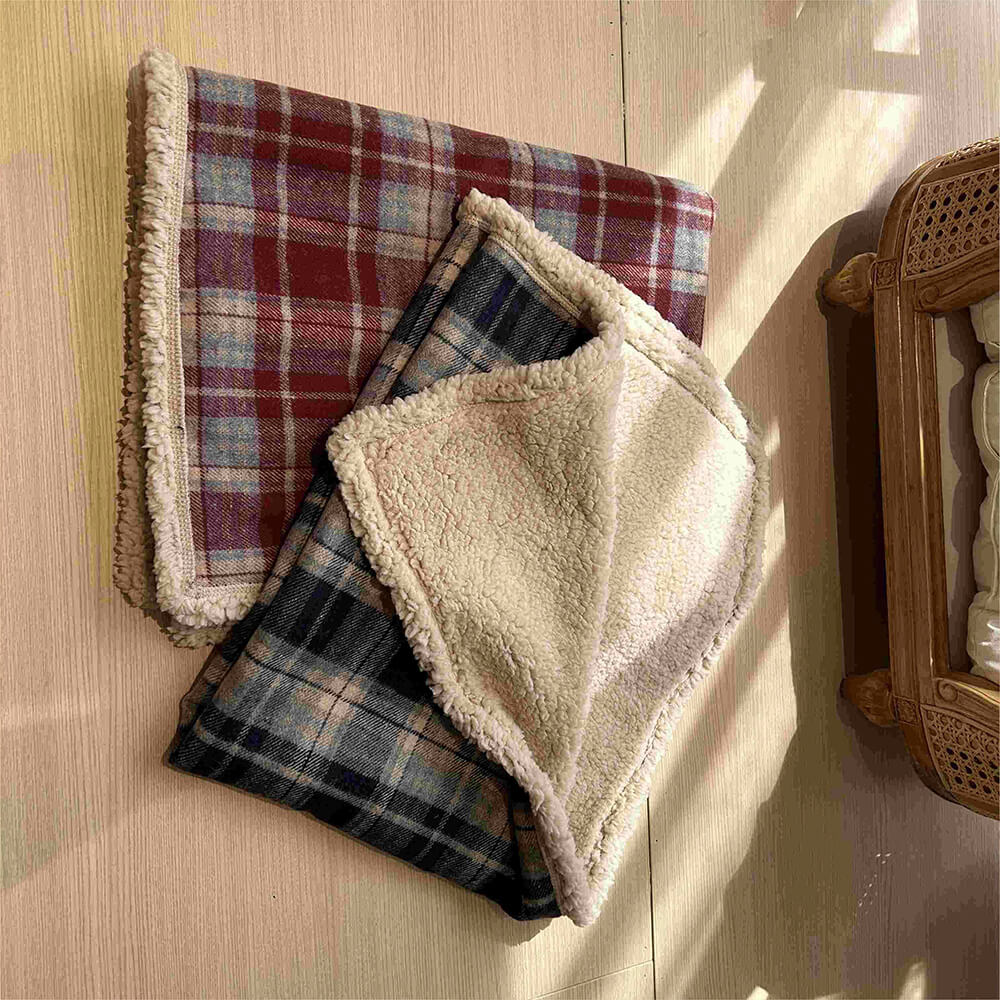Premium quality plaid sherpa fleece pet blanket, cozy comfort for all pets.