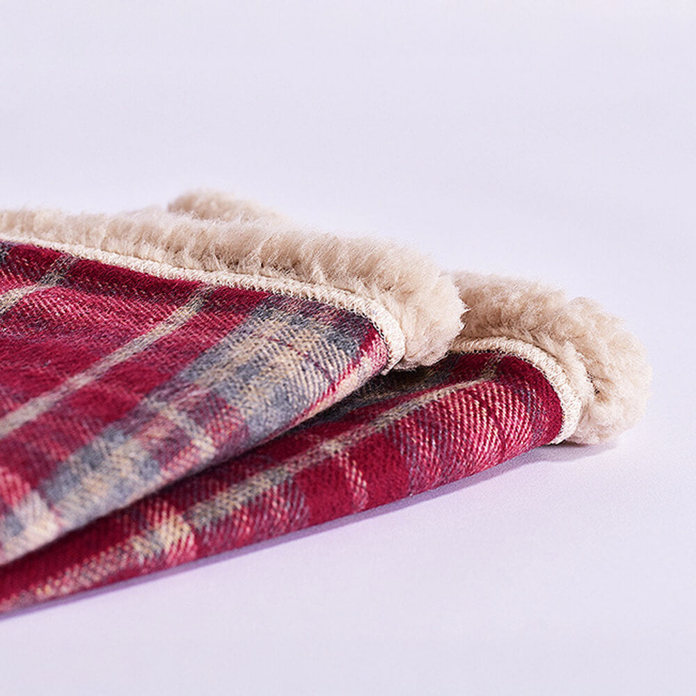 Ultra-soft sherpa fleece pet blanket with fashionable plaid print, machine washable.