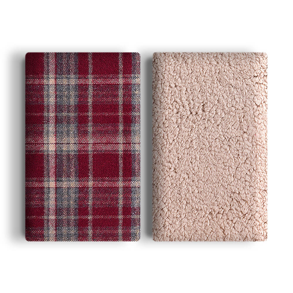 Snuggly pet plaid sherpa fleece blanket, providing warmth and security for pets.