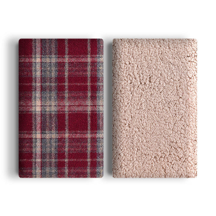 Snuggly pet plaid sherpa fleece blanket, providing warmth and security for pets.