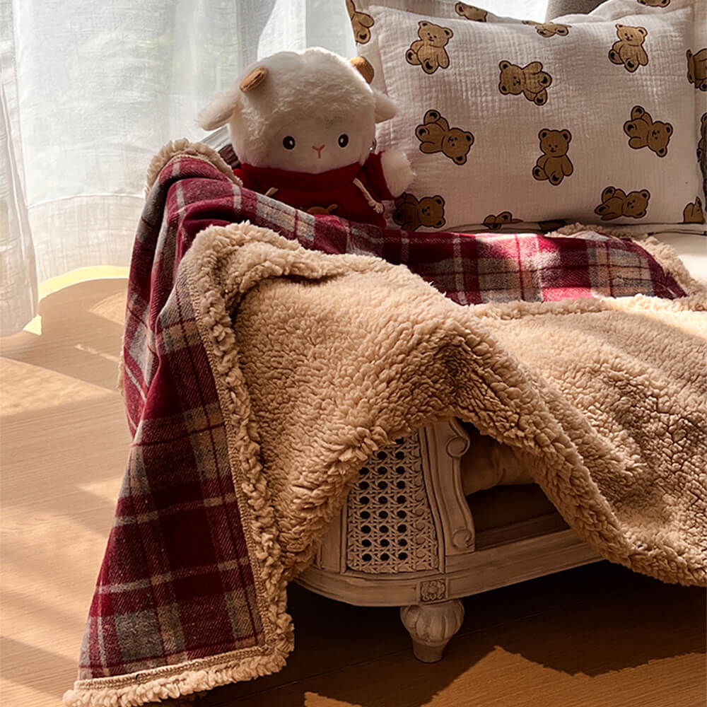Luxury green & navy plaid sherpa fleece pet throw, ideal cozy bedding for pets.