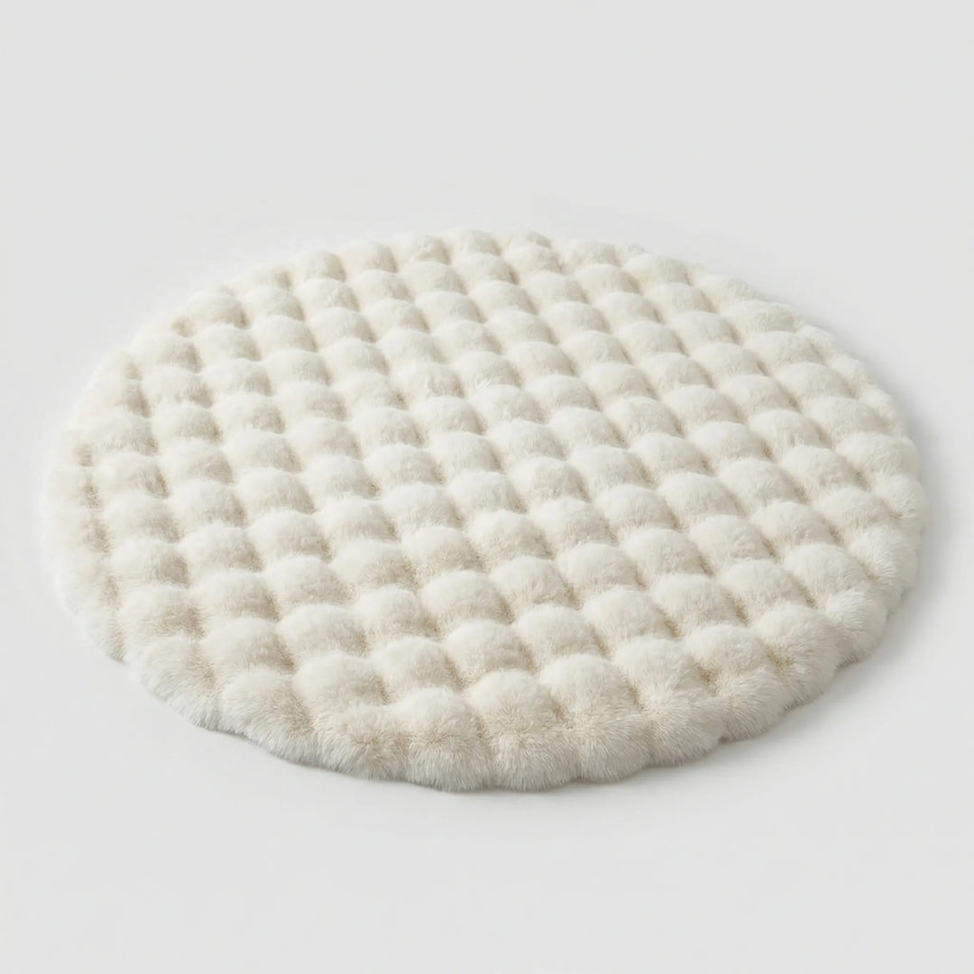 Soft round plush area rug, ideal for bedroom or nursery. Flowique wave design adds a cozy touch to any space.