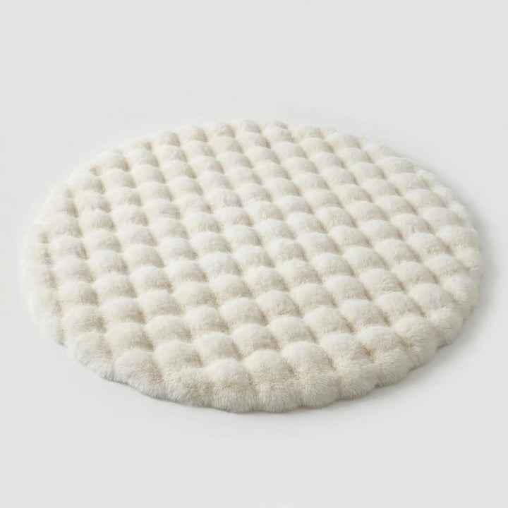 Soft round plush area rug, ideal for bedroom or nursery. Flowique wave design adds a cozy touch to any space.