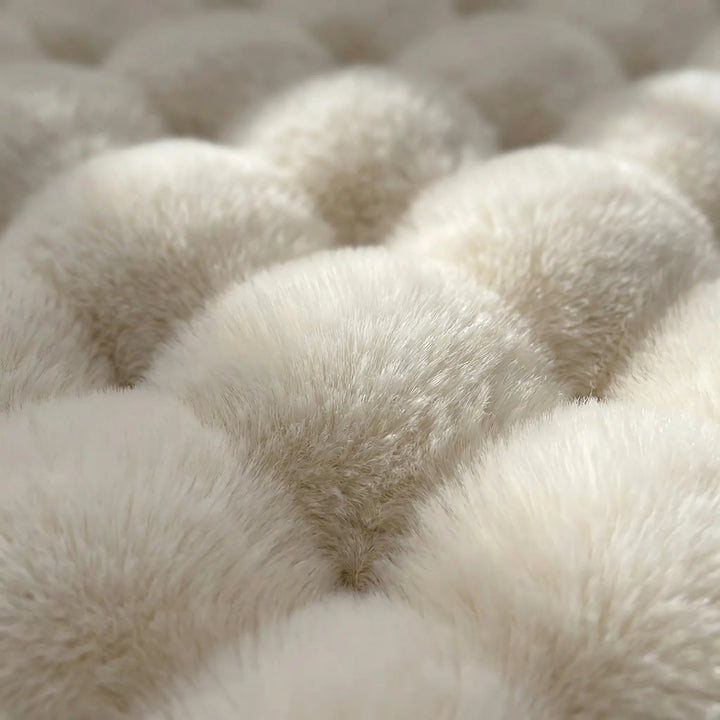 Flowique wave design on a round plush area rug. Soft, cozy texture enhances living room or bedroom home decor.