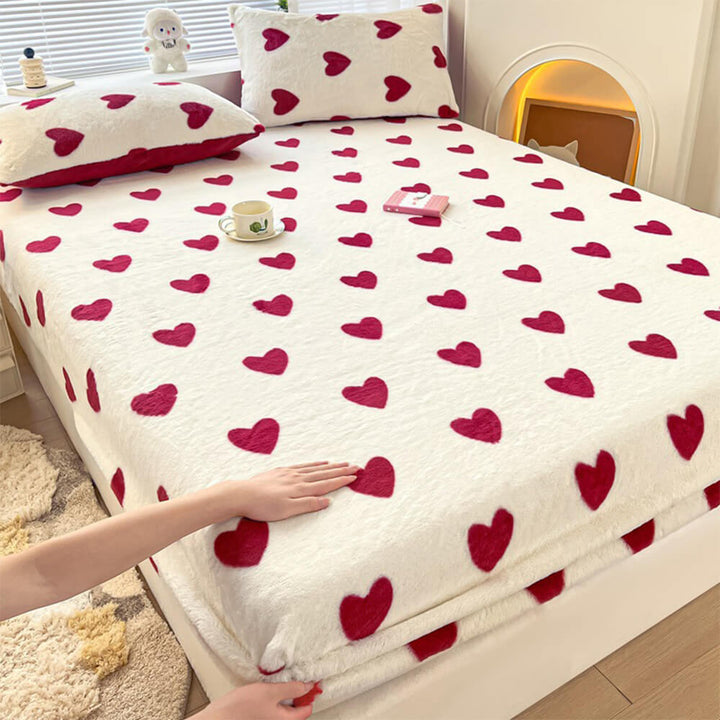 Cozy static-free velvet fitted sheet and pillowcase set in a soothing neutral color on a bed