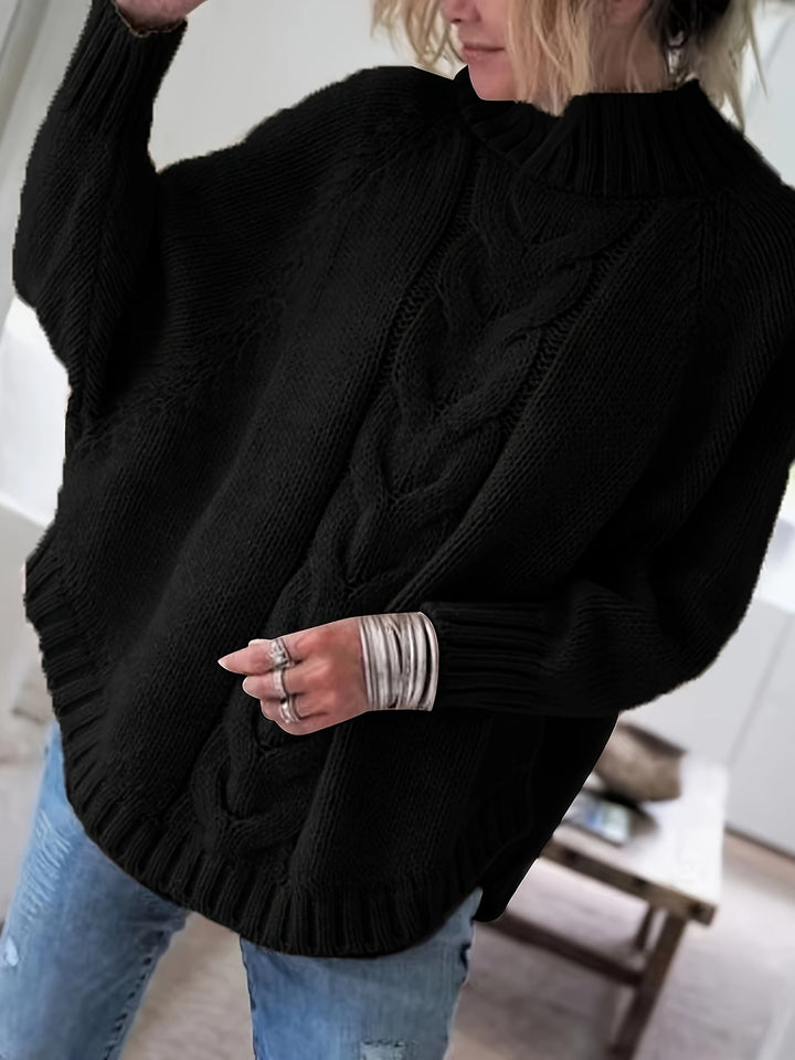 Model wearing a warm women's cable knit high-neck sweater with batwing sleeves.