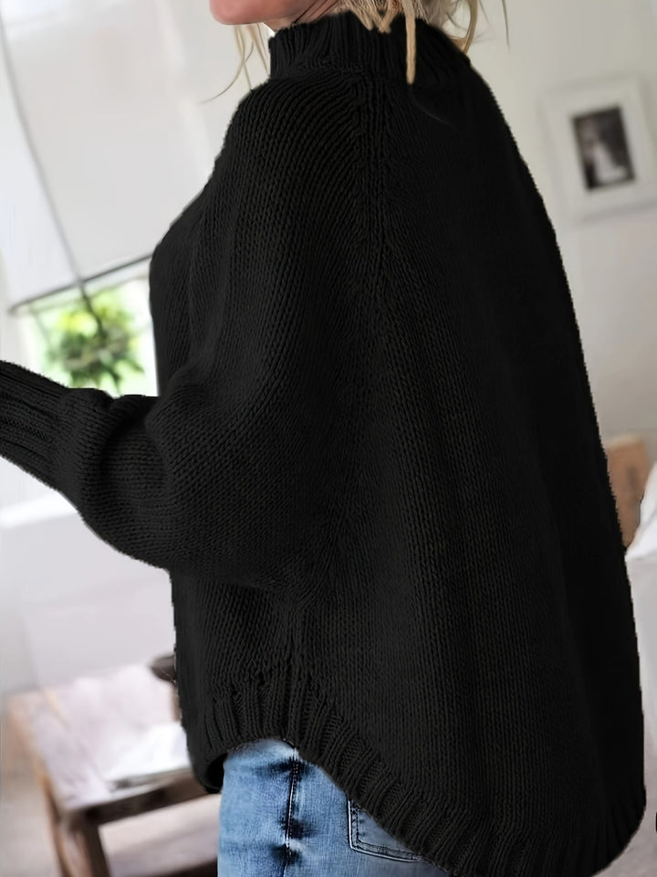 Women's fall fashion cable knit sweater, high-neck, with a flattering flared hem and oversized fit.