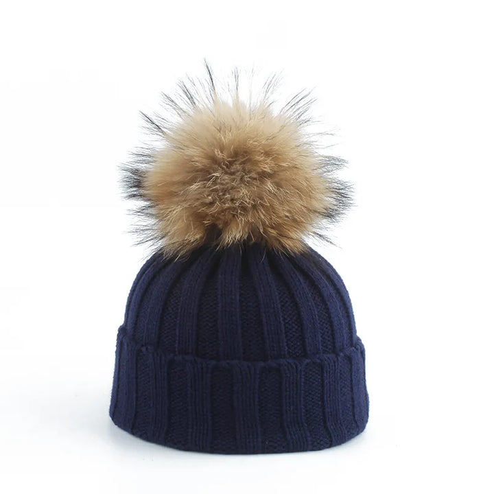 Stay warm with this women's cozy winter beanie, complete with a trendy faux fur pom-pom. Ideal headwear.