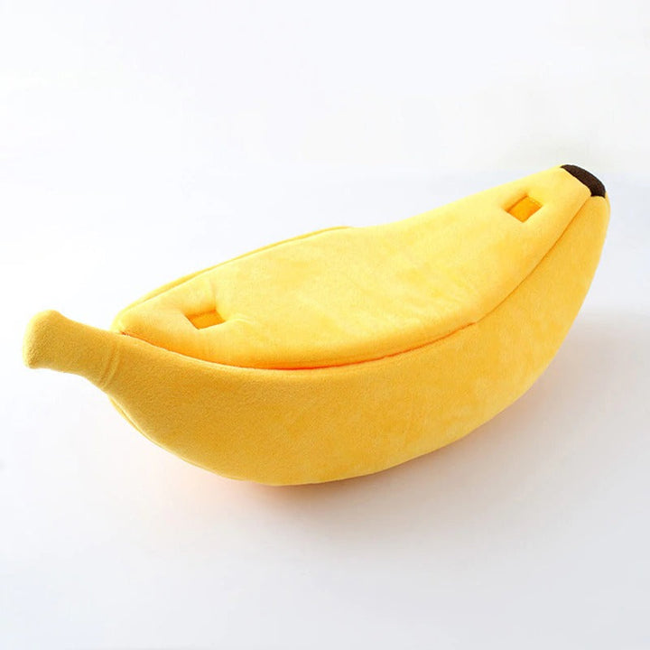 Cute banana-shaped cat bed, soft feline accessory for pet comfort.