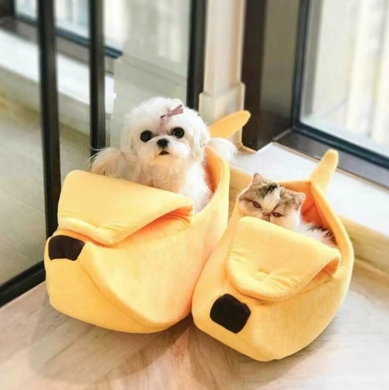 Cozy yellow banana-shaped pet bed for cats and small dogs, soft winter nest.