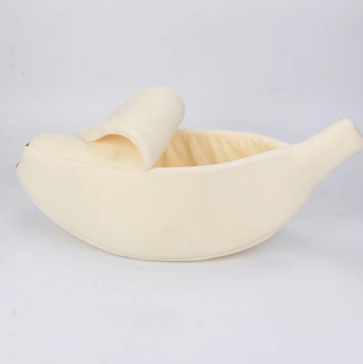 Yellow banana pet bed with a soft interior, suitable for both cats and dogs.