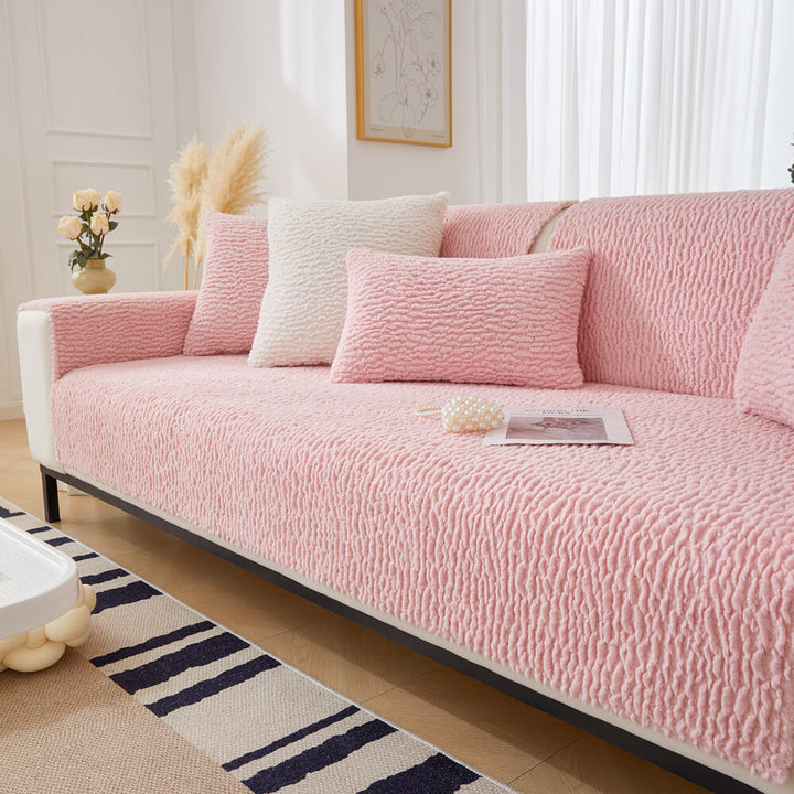 Easy installation of a non-slip cream berber fleece sofa protector for pet owners
