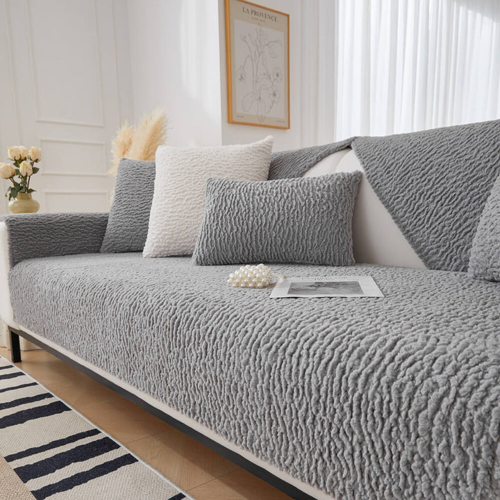 Close-up of cream berber fleece texture on a pet friendly sofa cover for home decor