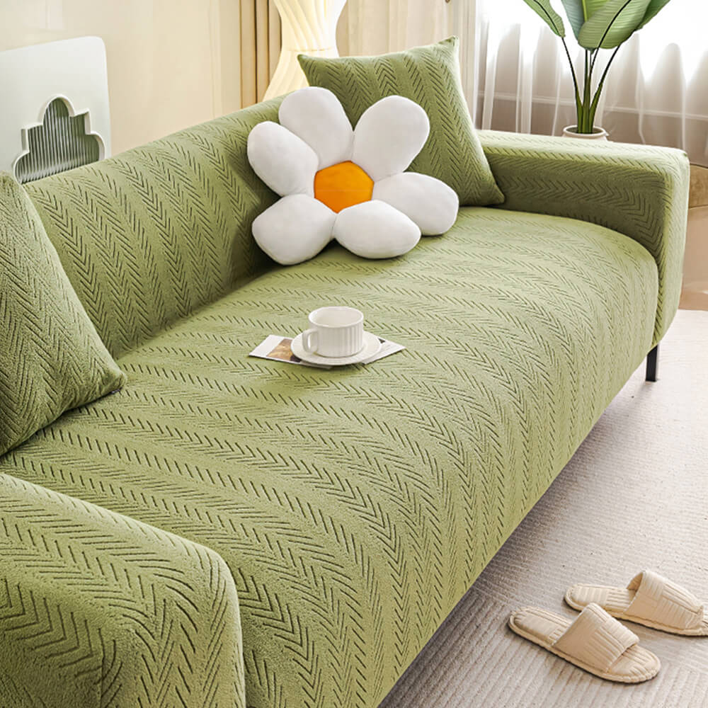 Versatile cream herringbone stretch sofa cover, pet-friendly and machine washable for easy living room decor.