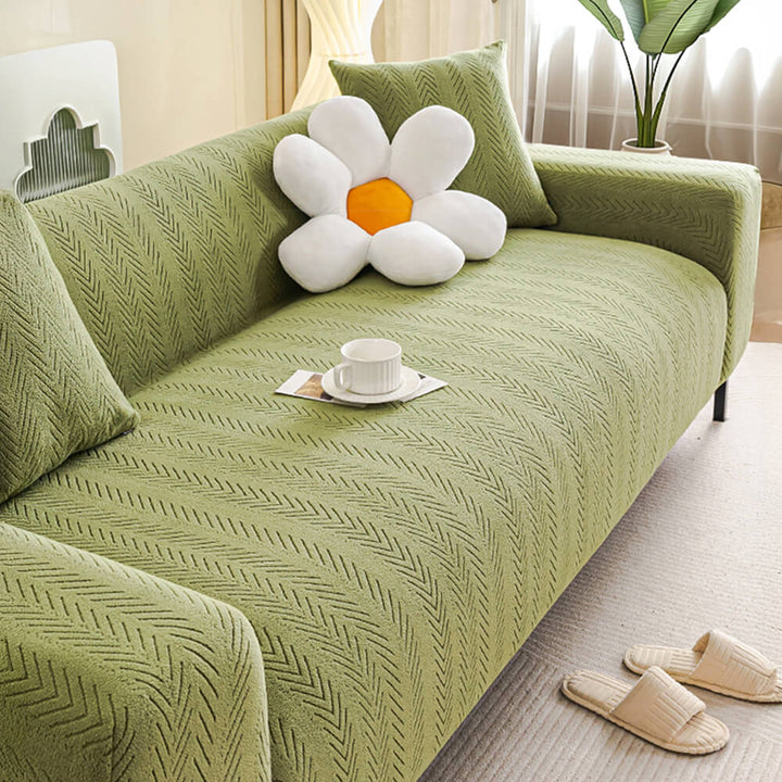 Versatile cream herringbone stretch sofa cover, pet-friendly and machine washable for easy living room decor.