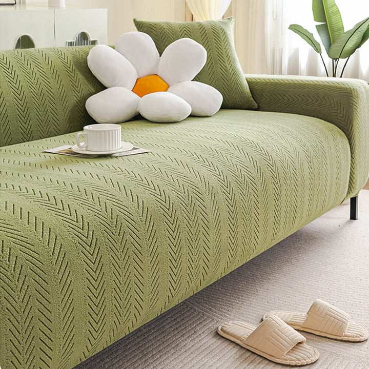 Stylish cream herringbone sofa slipcover, universal fit stretch cover, perfect for pet-friendly homes.