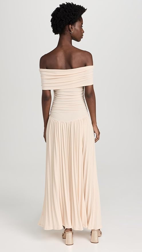 Elegant cream off-shoulder pleated maxi dress, sophisticated women's fashion.