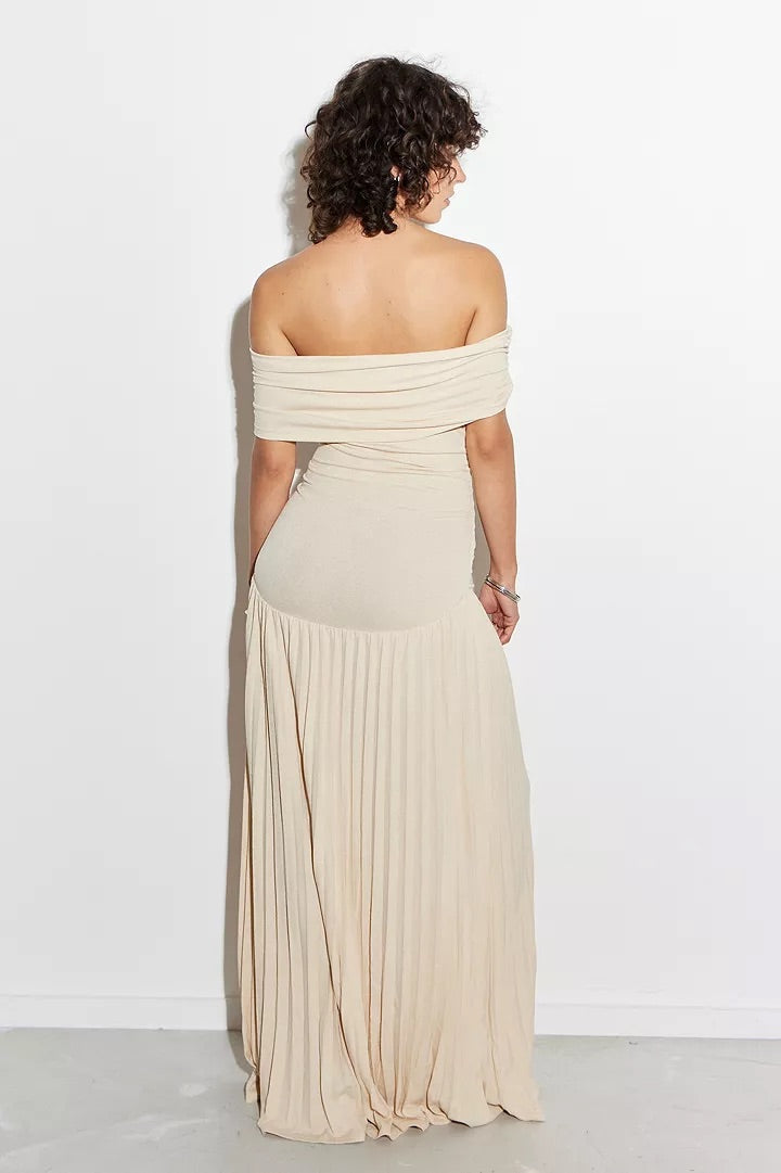 Sky blue pleated off-shoulder maxi dress for a sophisticated wedding guest look.