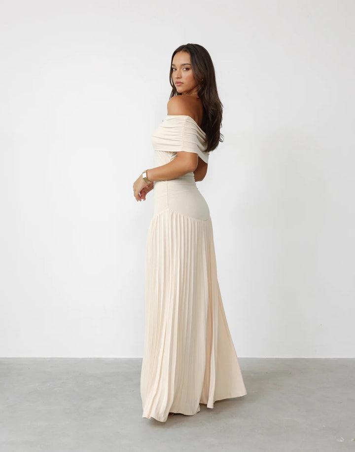 Beautiful cream pleated off-shoulder maxi dress, ideal for special occasions.