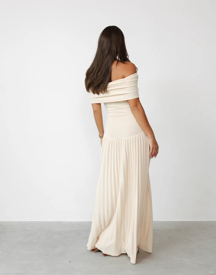 Stylish sky blue off-shoulder maxi wedding guest dress with delicate pleats.