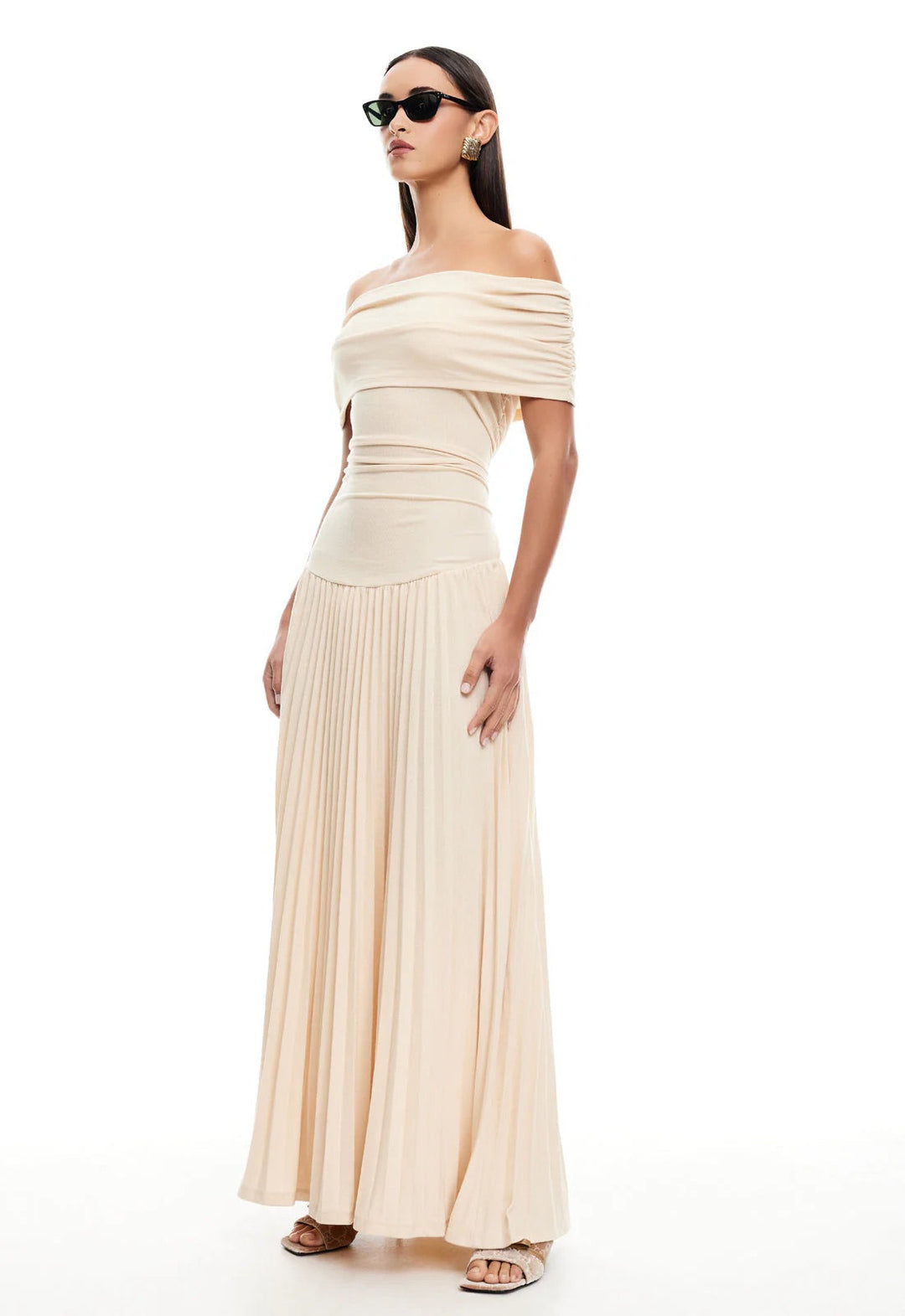 Women's cream off-shoulder maxi dress with elegant pleating, drop waist.