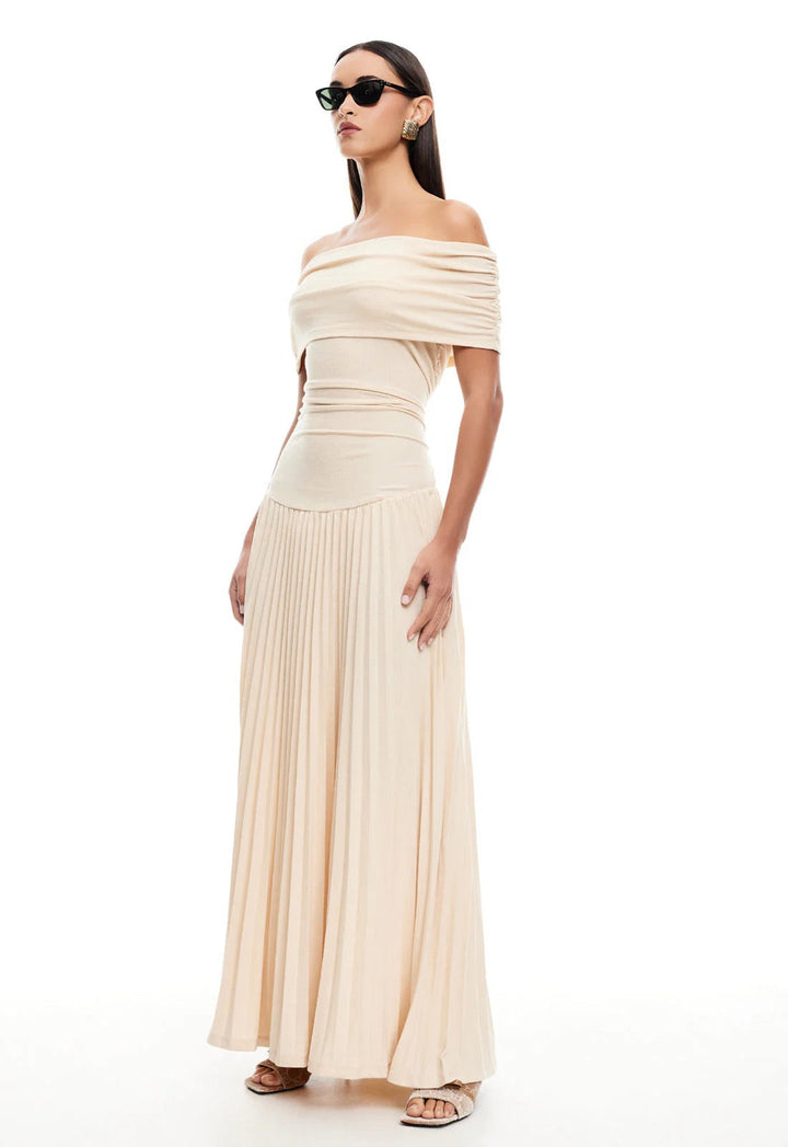 Women's cream off-shoulder maxi dress with elegant pleating, drop waist.