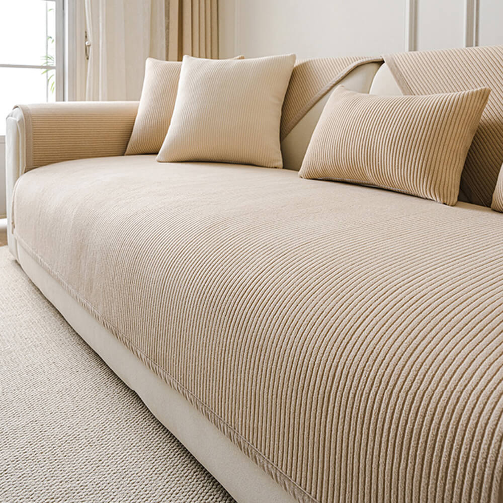 Cream vertical stripe couch cover, an essential non-slip fleece furniture protector for pet owners.