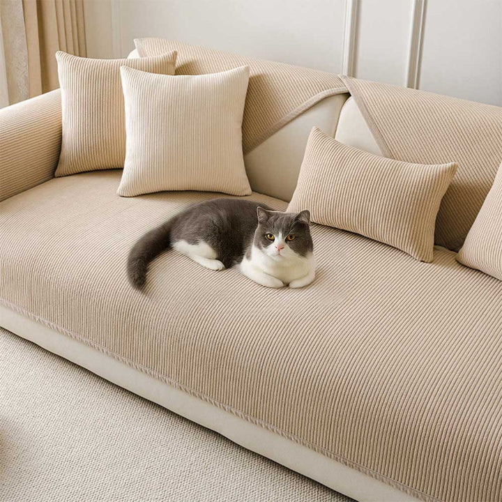 Close-up of cream fleece couch cover with vertical stripes, showcasing soft texture for pet-friendly home decor.