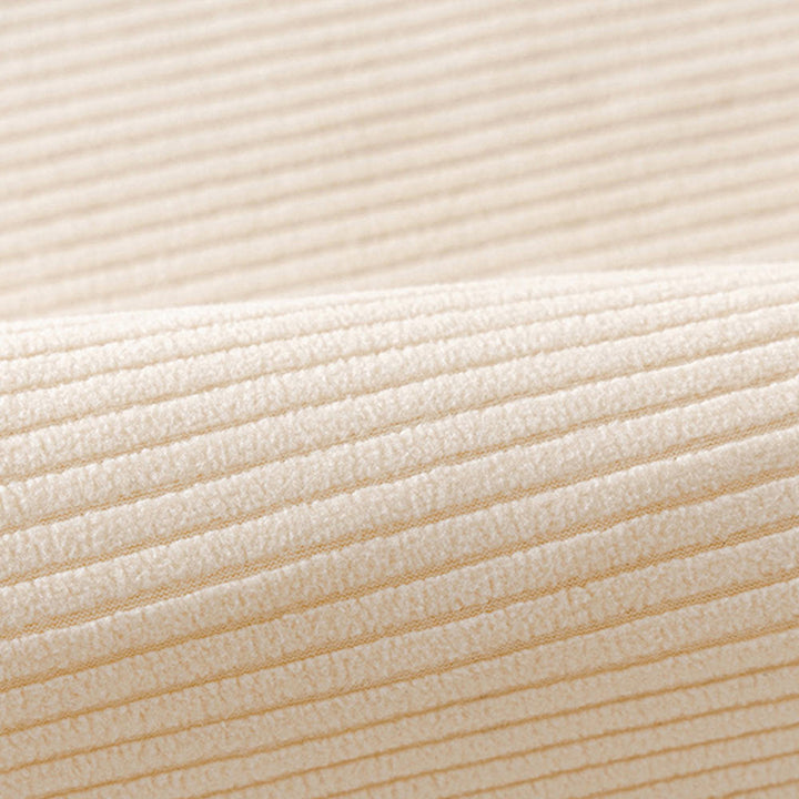Detail of the vertical stripe pattern on a cream fleece couch cover, suitable for pet-proof interiors.