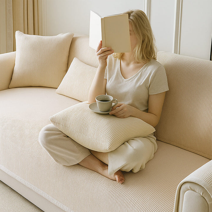 Soft cream fleece sofa cover with vertical stripes, offering comfort and protection from pets and kids.