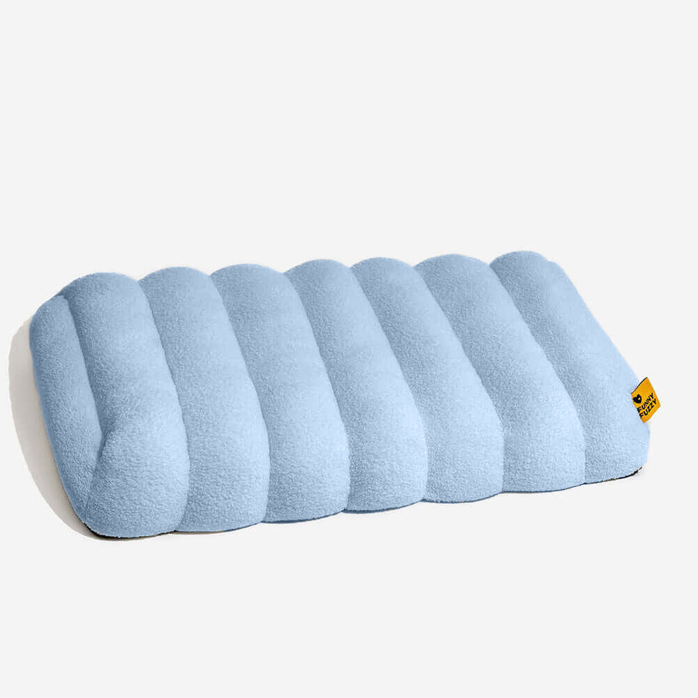 Washable creamy orthopedic dog bed for year-round pet comfort.