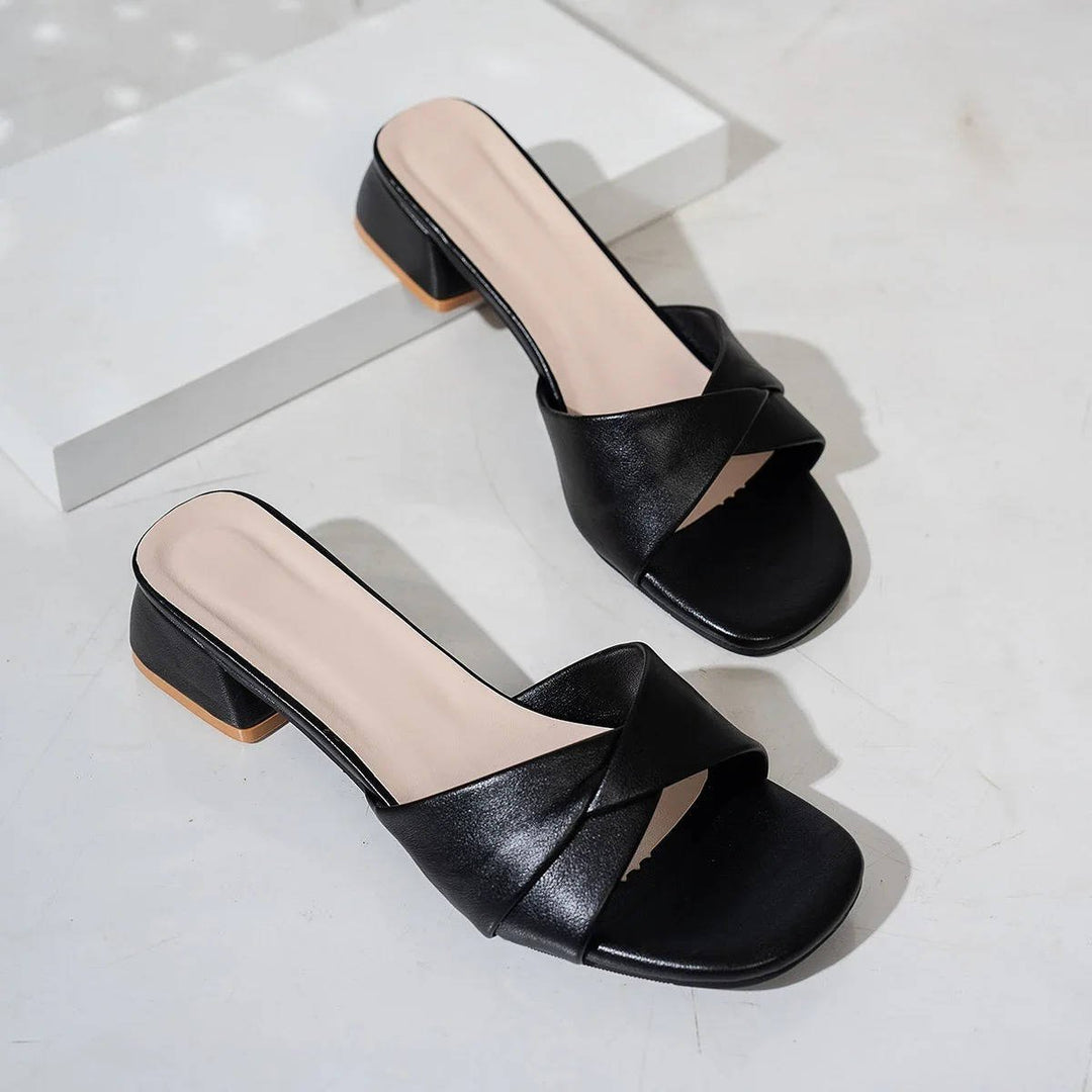Summer-ready women's elegant cross-strap block heel slide sandals with a square toe.