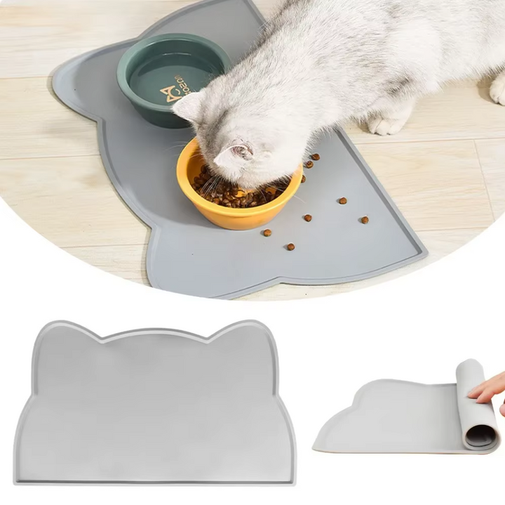 Cute cat-shaped silicone non-slip pet feeding mat for cat bowls, ensuring pet hygiene and stable feeding.