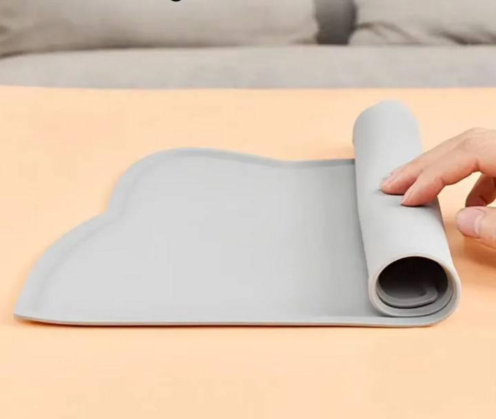 Pet feeder mat: cat-shaped non-slip silicone mat designed for pet bowls, enhancing pet hygiene.