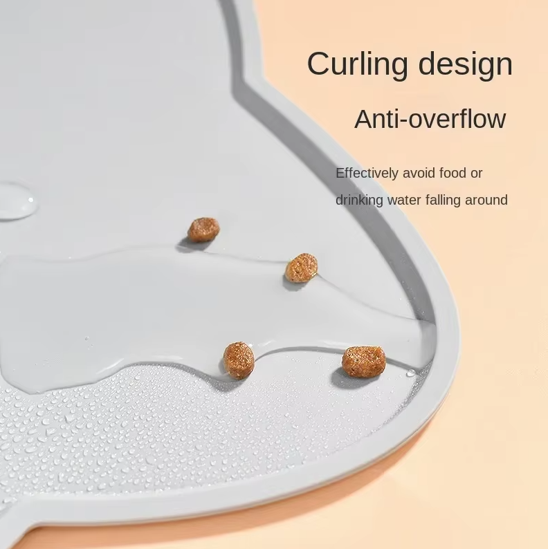 Durable silicone cat-shaped feeding mat for pet bowls, a reliable non-slip cat accessory for pets.