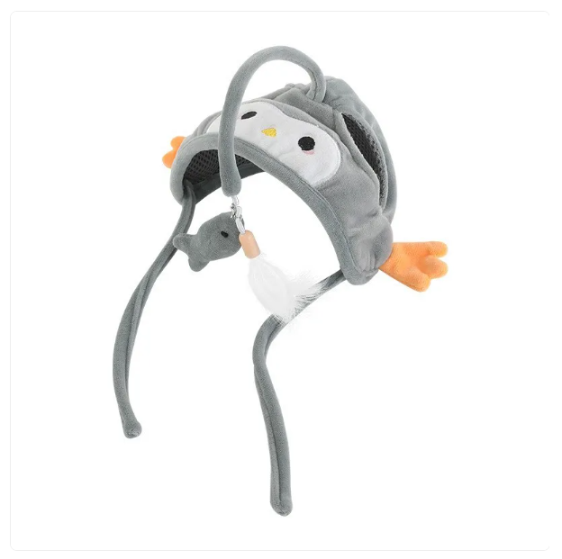 Pet apparel cat hat with a feather toy, in action as a cat pounces on the pendant.
