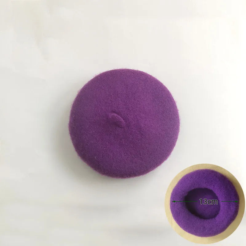 Orange felt pet beret on a fluffy dog, a cute and stylish pet accessory.