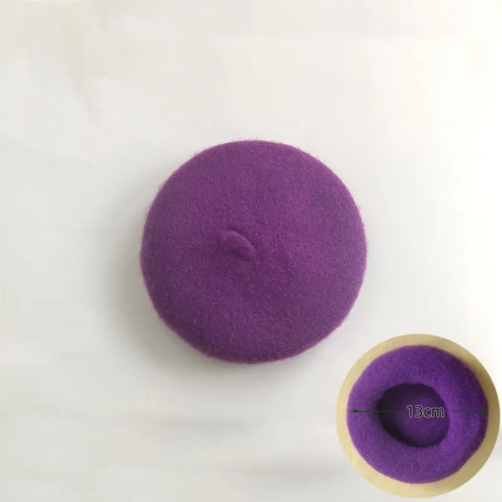 Orange felt pet beret on a fluffy dog, a cute and stylish pet accessory.