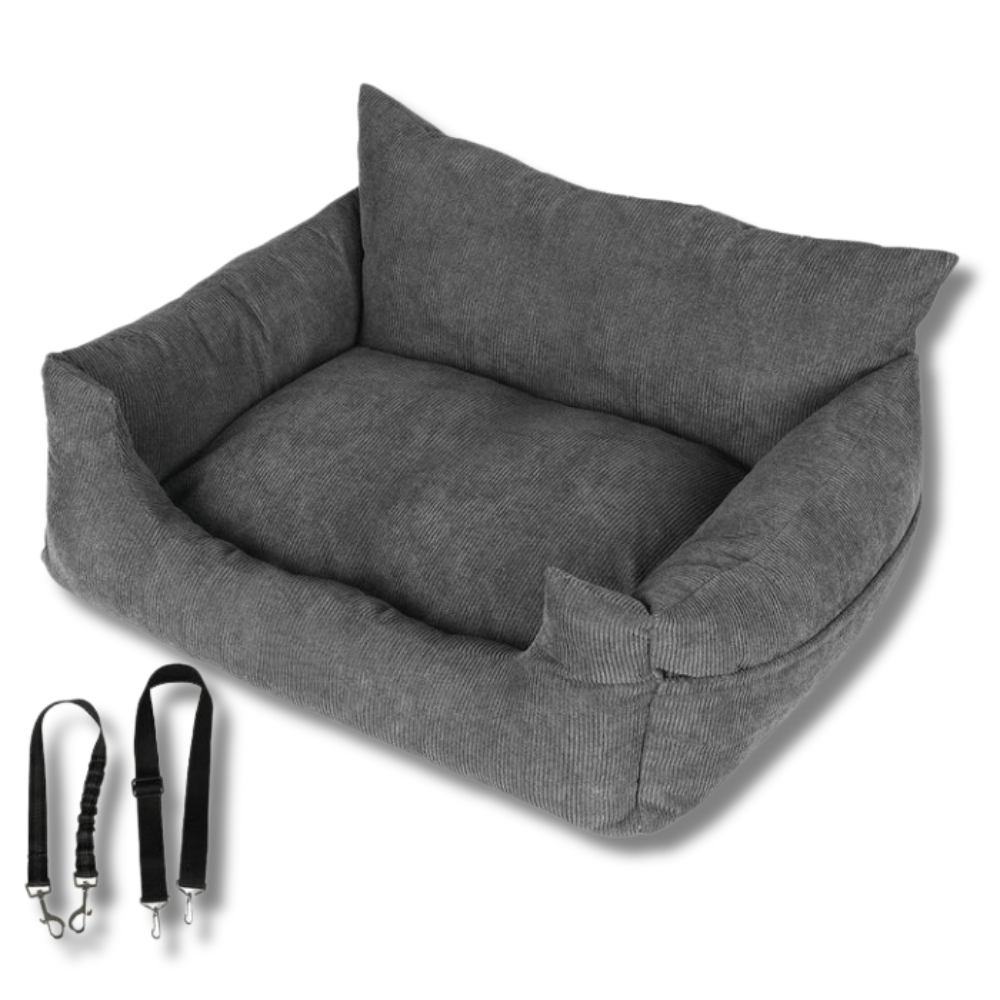 A sleepy kitten nestled in a cozy, plush purple pet bed for small pets, highlighting the bed's comforting and calming features