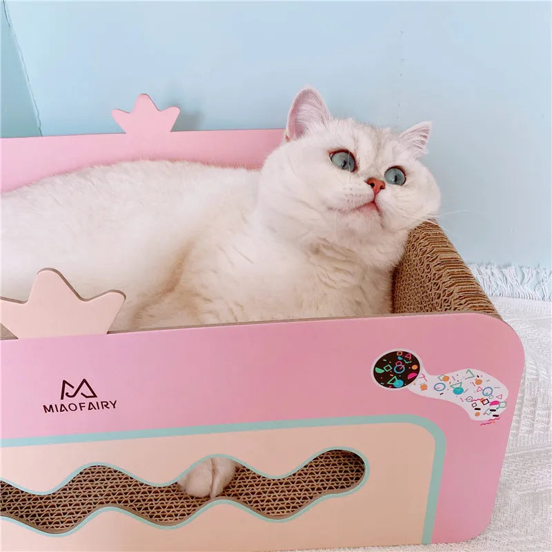 Cute pink cat scratching furniture with hanging toy and cozy retreat for feline play and relaxation